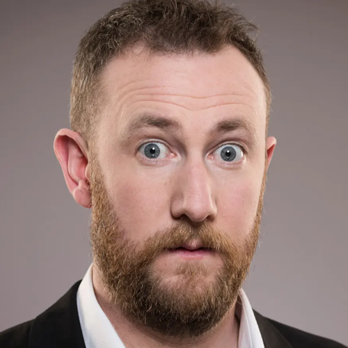 A light-skinned man with short light brown hair, mustache, and beard